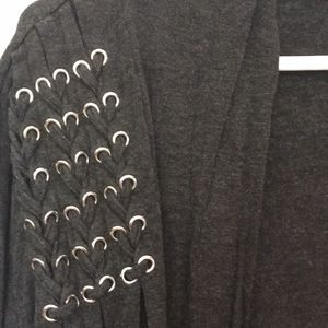 Dark gray open sweater.